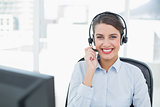 Beautiful classy brown haired operator answering a call
