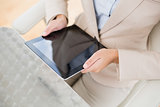 Close up of a businesswoman holding a tablet pc