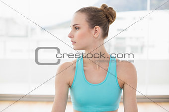Sporty calm woman looking away