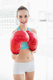 Sporty happy woman boxing