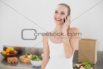 Happy young woman on the phone