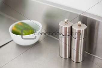 Salt and pepper on a chrome counter