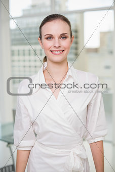 Happy businesswoman looking at camera