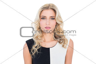 Thoughtful blonde model looking at camera