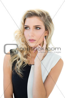Thoughtful attractive blonde model looking away