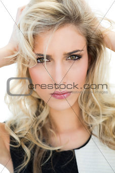 Passionate blonde model looking at camera