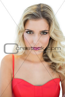 Pleased sexy blonde model looking at camera