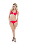 Attractive mysterious blonde model wearing red bikini looking at camera