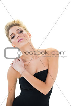 Unsmiling passionate blonde model posing for camera