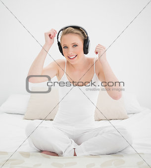 Natural happy blonde listening to music