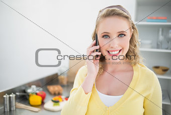 Smiling cute blonde phoning