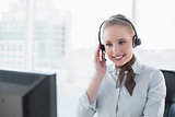 Blonde attractive businesswoman wearing a headset