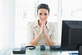 Nervous stylish brunette businesswoman praying