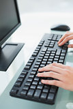Close up of a businesswoman typing on a computer