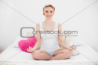 Meditating young woman with opened eyes