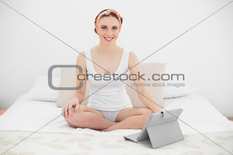 Smiling woman working with her tablet