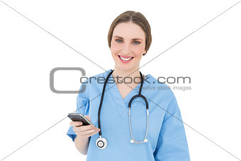 Young woman doctor holding her smartphone