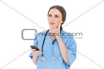 Young woman doctor thinking