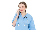 Woman doctor phoning with her smartphone
