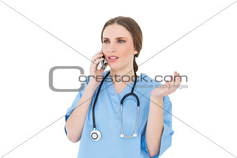 Young woman doctor phoning