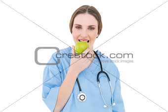 Female doctor eating an apple