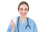 Female doctor holding a plastic cup
