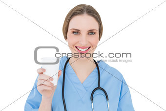 Female doctor holding a plastic cup