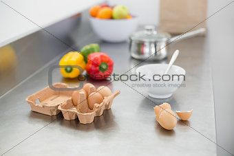 Vegetables and eggs lying on the work surface