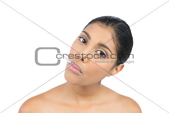 Serious nude brunette having thermometer in mouth