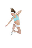 Sporty slender woman wearing sportswear jumping