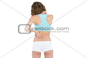 Rear view of slender brunette woman wearing sportswear
