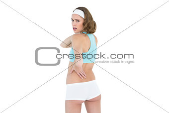 Attractive slender woman wearing sportswear looking at camera