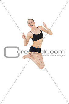 Euphoric slim model jumping in the air