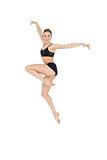 Smiling slim ballet dancer jumping in the air