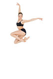 Cheerful slim ballet dancer jumping in the air