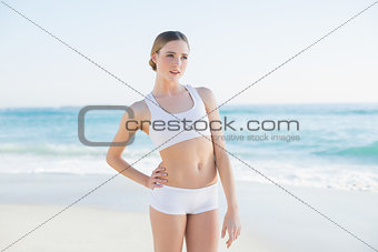 Attractive slender woman standing hand on hips