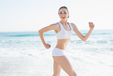 Cheerful slender woman running