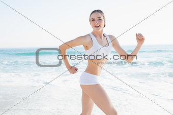 Cheerful slender woman running