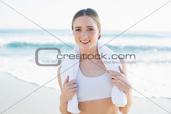 Slender woman holding white towel