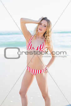 Attractive blonde woman posing on a beach
