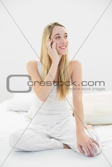 Gorgeous peaceful woman phoning with her smartphone
