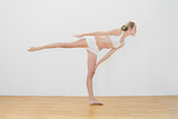 Sporty fit woman doing yoga pose wearing sportswear