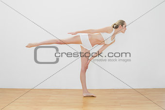 Sporty fit woman doing yoga pose wearing sportswear