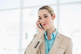 Calm businesswoman phoning with her smartphone