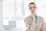 Chic thoughtful businesswoman posing in her office
