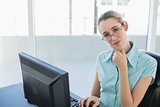 Attractive thoughtful businesswoman working on her computer