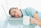 Calm businesswoman napping sitting on her swivel chair