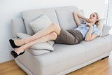 Calm businesswoman lying on couch