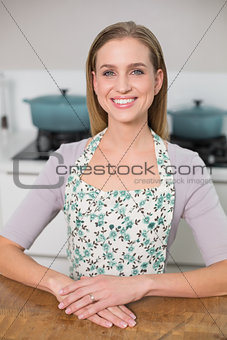 Smiling gorgeous model sitting at table