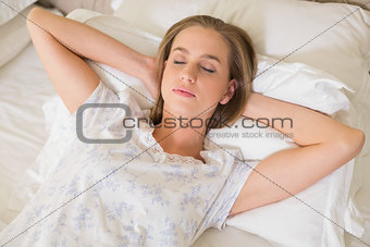 Natural peaceful woman napping in bed